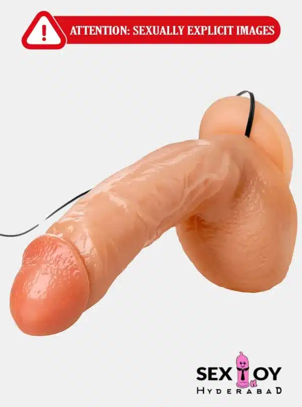 A close-up photo of a multi-speed realistic vibrating dildo, featuring lifelike textures and adjustable vibration settings.